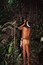 Huaorani Indian hunting squirrels in rainforest, Ecuadorian Amazon South America