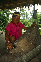Secoya Indian shaman grinding maize, Rio Agua Rico, Ecuadorian Amazon, 1994