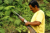Colonizers holding a gun, Ecuadorian Amazon, 1994