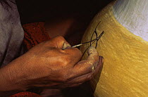 Zaparo indian woman painting ceramic pot, Llanchamacocha, Ecuadorian Amazon, South America