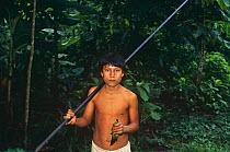 Indian with blowdart used to shoot Maroon tailed parakeet, Llanchamacocha, Ecuador Amazon,