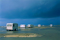 Caravans on land flooded by sea Camargue, France