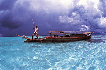 Traditional Bajau lepa boat with carving, Malaysia. Bajau people live in houses on stilts or are nomadic in houseboats.