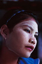 Bajau girl with burak on her face, Malaysia. Bajau people live in houses on stilts or are nomadic in houseboats. 2000