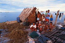 Family of seaweed growers. Arenas, Cagayancillo, Philippines. Seaweed used to produce carageen, a binding agent used extensively in cosmetic products. 2000