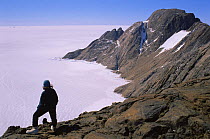Person standing on Scullin Monolith, Australian Antarctic Territory, Antarctica December