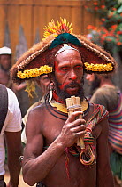 Huli wigman with pan pipes at Market in Tari, Central Highlands, Papua New Guinea