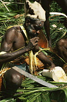 Asmat man at a sago ceremony, in traditional clothing, Irian Jaya / West Papua, New Guinea 1991 (West Papua).