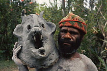 Asaro mudman holding mud mask Irian Jaya / West Papua, Papua New Guinea 1991 (West Papua).