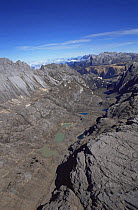 Aerial view of Mount Jaya glacial valleys, Irian Jaya / West Papua, Papua New Guinea 1991 (West Papua).