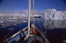 Bow of boat Golden Fleece approaching iceberg, Antarctic Peninsula summer