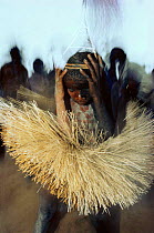 Grass skirted pygmy boy dancing in Circumsion ceremony, Mandima village, Dem Rep of Congo