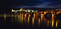Charles Bridge and river at dusk with St Vitus Cathedral, Prague, Czech Republic