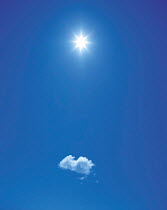 Y-2802 Sun shining above single cloud in blue sky