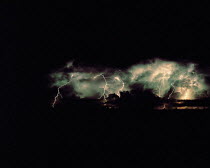 Y-10801 Forked lightning racing across sky at night
