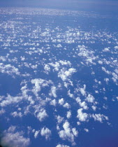 Y-4101 Looking down on Altocumulus clouds in blue sky