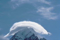 Cap or Lenticular cloud above mountain summit, New Zealand