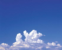 Y-3505 Cumulonimbus clouds low in blue sky