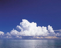 Y-1005 Cumulonimbus clouds in blue sky above sea