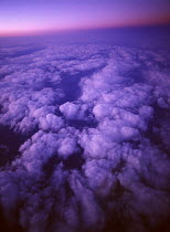 Y-9203 Aerial view high above clouds, sunset horizon