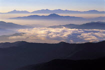 Y-9104 Mountain range with cloud and mist lieing in valleys between peaks, Japan