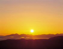 Y-8602 Sun setting above mountain ridge, Norikuradake, Nagano, Japan