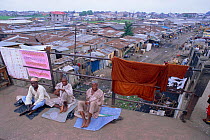 Beggars on railway bridge in the Bidonville slums of Lagos, Nigeria, West Africa 2002