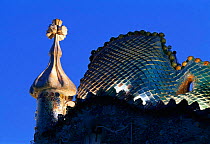 Gaudi's Casa Batillo roof facade floodlit at night, Barcelona, Catalunya, Spain