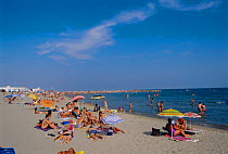 Holiday makers on the beach, Stes Maries de la Mer, Camargue, France