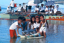 Children with small model Whale shark made of bamboo and rice sack material for whale shark festival in Donsol, a small fishing village in the Philippines 2002