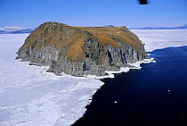 Talan island surrounded by sea ice in early spring, Sea of Okhotsk, East Russia