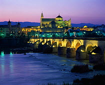 The Mezquita Mosque and Puente Romano floodlit at night, Cordoba, Andalucia, Spain