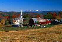 Village church and red barn, Peachem, Vermont, USA