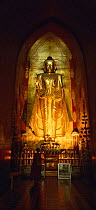 Standing Buddha inside temple at Ananda Pahto, Bagan (Pagan) Burma / Myanmar
