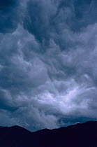 Turbulent dark rain clouds Bwindi forest NP, Uganda