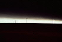 Sky and ground blackened by smoke and fallout from bombed oil wells after 1st Gulf war, Kuwait 1990