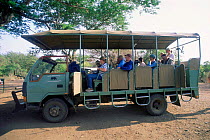 Tourists in Safari truck to see animal in Simunye Zulu Lodge Game Reserve, South Africa
