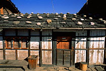 Traditional house with wooden shingle roof, Jakar, Bumthang, Central Bhutan 2001