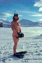 Doug Allan, BBC Natural History Unit cameraman without wetsuit, but with beard and camera. Antarctic, 1985. Antarctica