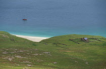Mingulay Is with isolated house and boat moored, Outer Hebrides, Scotland, UK