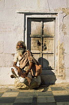 Holy man / saddhu wearing modern watch, age 40, Pushkar, Rajasthan, India
