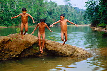 Machiguenga Indian children playing in River. Lower Urubamba River. Amazon Rainforest, Peru. South America
