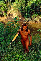Yaminahua Indian man with bow and arrow. Boca Mishagua River, Amazon rainforest, Peru. South America. People contacted in 1988