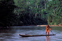 Yaminahua indian fisherman in canoe, Boca Mishagua river, Amazonia, Peru. First contacted