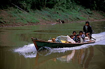 Local indians in canoe, Heath river, Amazonia, Peru
