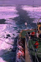 Russian ice breaker ship carving channel through ice, with helicopter landing on board, Weddell Sea, Antarctica
