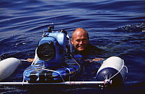 Simon King filming in sea with floating camera, Azores, Atlantic Ocean