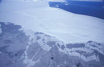 Aerial view of sea ice, spring, Svalbard, Norway. Open sea (top) solid white ice floe (middle)