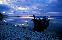 Fishing boat at dawn / dusk, Lake Baikal, Siberia, Russia