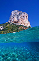 Split level shot of sea and coastal rocky shore, Penon Ifach NP, Alicante, Spain
